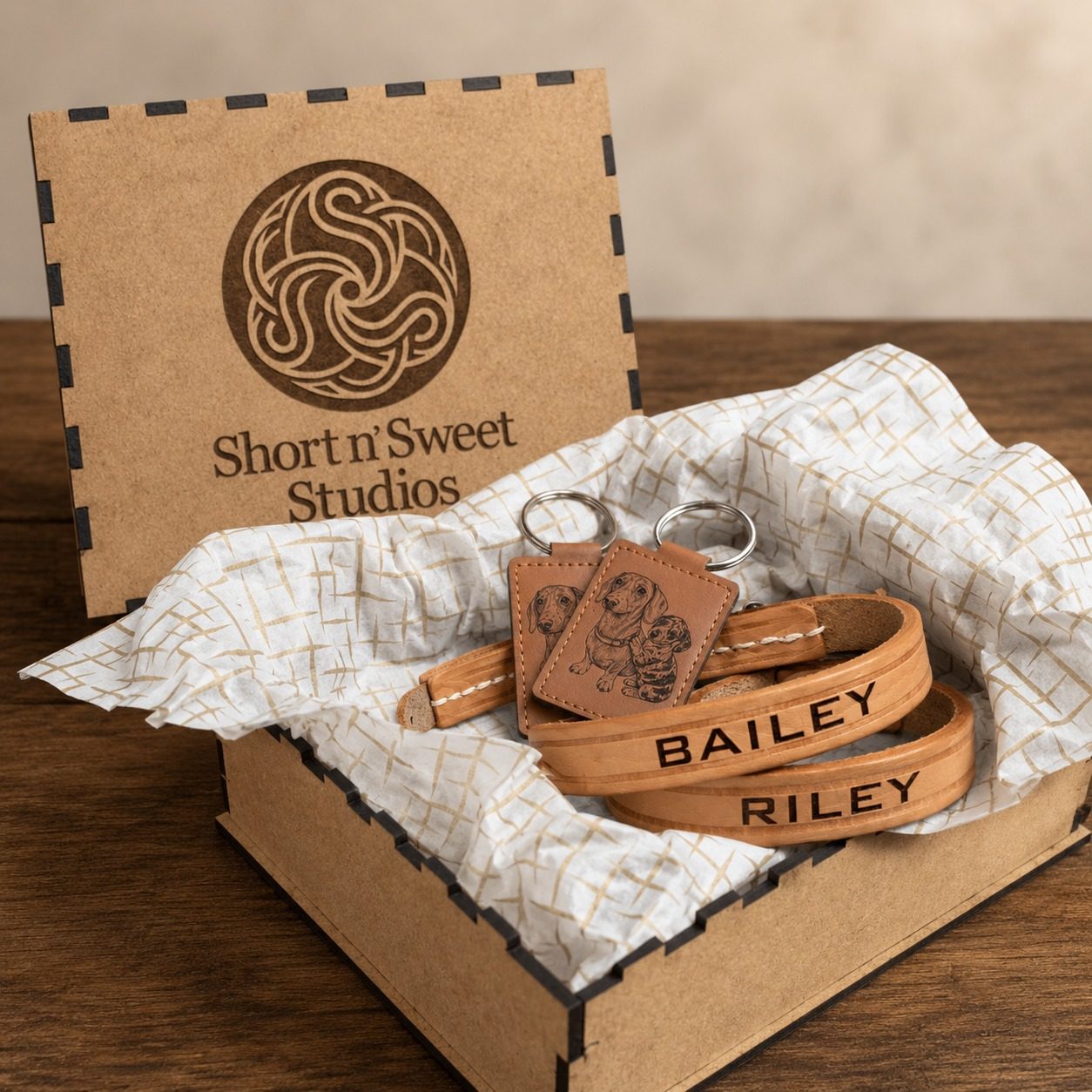 A personalised leather pet collar and keyring presented in a wooden Short n Sweet Studios gift box